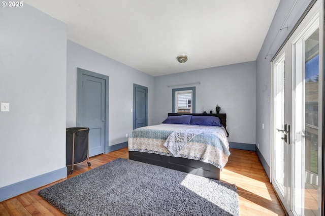 803 Main St, Philomath, OR 97370 - bedroom featuring light wood-type flooring, baseboards, and two closets