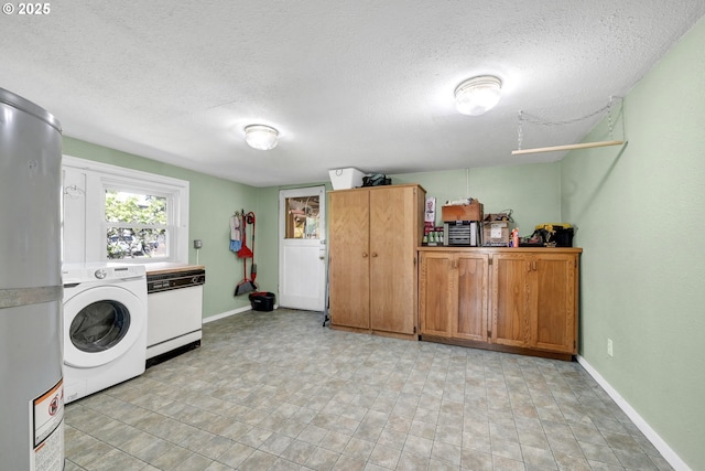 803 Main St, Philomath, OR 97370 - laundry area featuring washer / clothes dryer, a textured ceiling, and baseboards