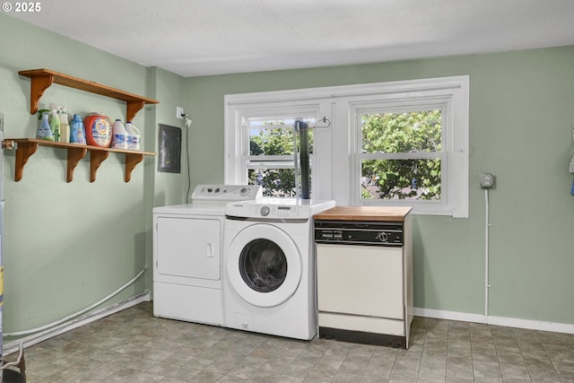 803 Main St, Philomath, OR 97370 - washroom featuring washer and clothes dryer, baseboards, and a textured ceiling