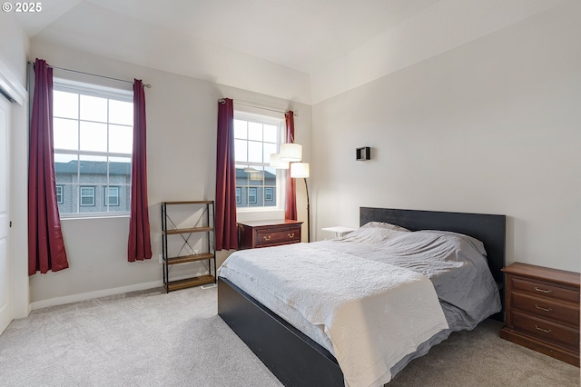 bedroom with carpet and baseboards