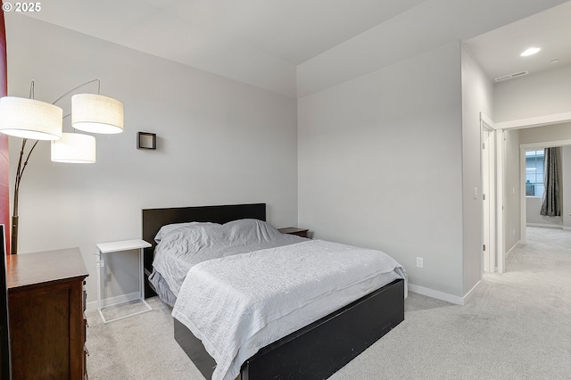 bedroom featuring light carpet, visible vents, recessed lighting, and baseboards