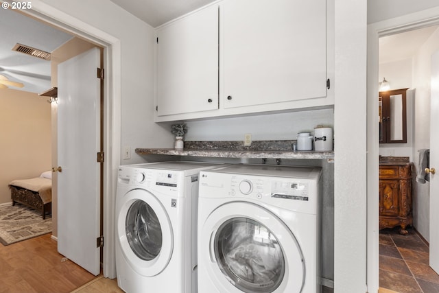 1175 Northside Rd, Sutherlin, OR 97479 - laundry room featuring separate washer and dryer and cabinet space