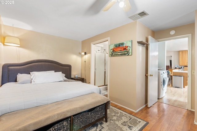 1175 Northside Rd, Sutherlin, OR 97479 - bedroom with light wood-type flooring, washing machine and clothes dryer, ceiling fan, and baseboards