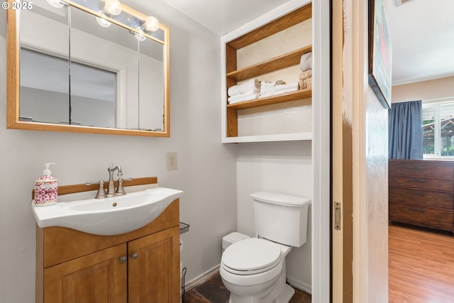 1175 Northside Rd, Sutherlin, OR 97479 - half bath featuring toilet, vanity, and wood finished floors