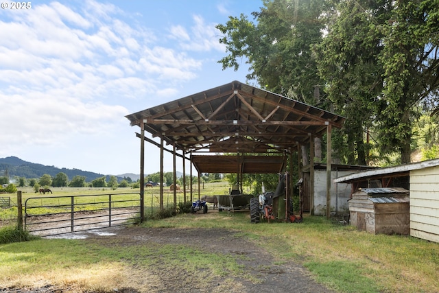 1175 Northside Rd, Sutherlin, OR 97479 - view of vehicle parking featuring fence, a mountain view, a carport, driveway, and a view of countryside