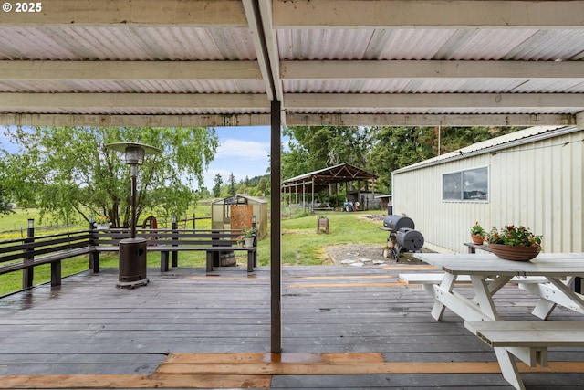 1175 Northside Rd, Sutherlin, OR 97479 - wooden deck featuring a yard, a grill, and an outbuilding