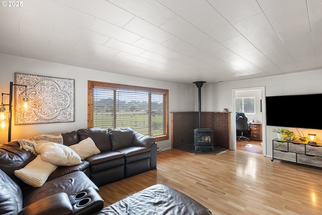 1175 Northside Rd, Sutherlin, OR 97479 - living room with a wood stove, healthy amount of natural light, and wood finished floors
