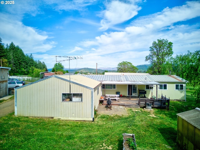 1175 Northside Rd, Sutherlin, OR 97479 - rear view of property with a lawn and metal roof