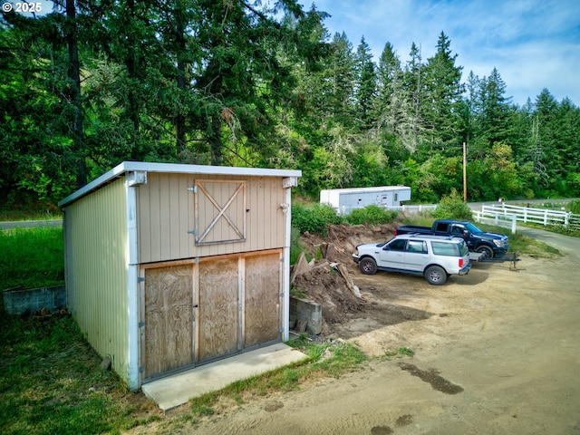 1175 Northside Rd, Sutherlin, OR 97479 - view of shed featuring fence and a forest view