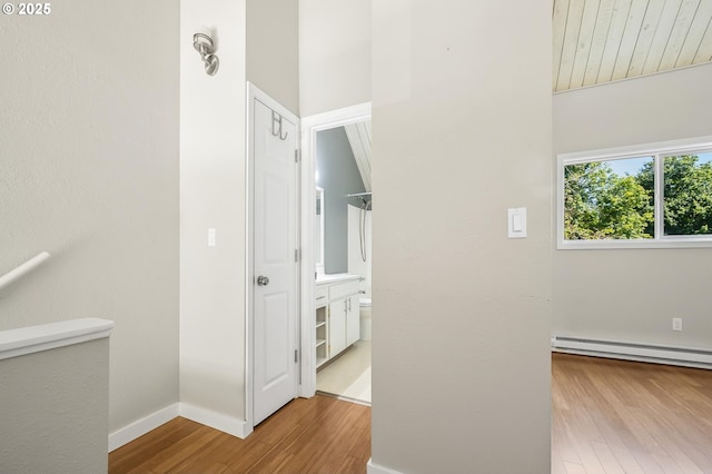 4 Touchstone # 138, Lake Oswego, OR 97035 - corridor featuring wood finished floors, baseboard heating, and baseboards