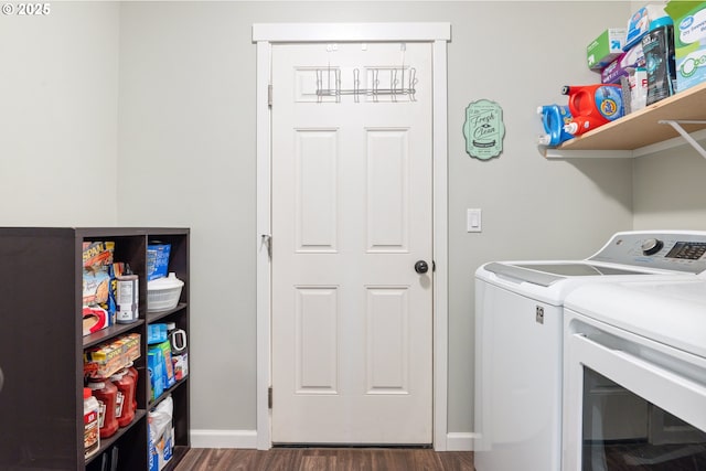 clothes washing area with dark hardwood / wood-style flooring and separate washer and dryer