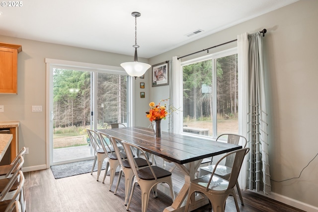 dining area featuring light wood-type flooring