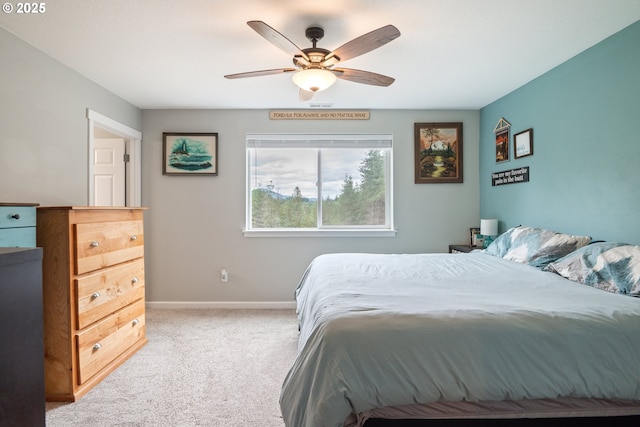 bedroom featuring ceiling fan and light carpet