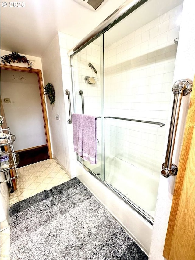 1021 Starlight St, The Dalles, OR 97058 - bathroom with bath / shower combo with glass door and tile patterned floors