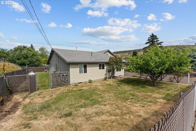 1021 Starlight St, The Dalles, OR 97058 - rear view of house with a gate and a shingled roof