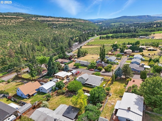 1021 Starlight St, The Dalles, OR 97058 - aerial perspective of suburban area featuring a mountain backdrop and a heavily wooded area