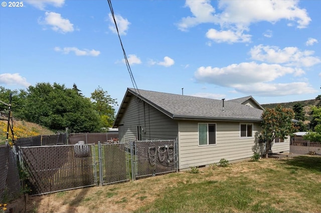 1021 Starlight St, The Dalles, OR 97058 - view of home's exterior with a gate and a shingled roof
