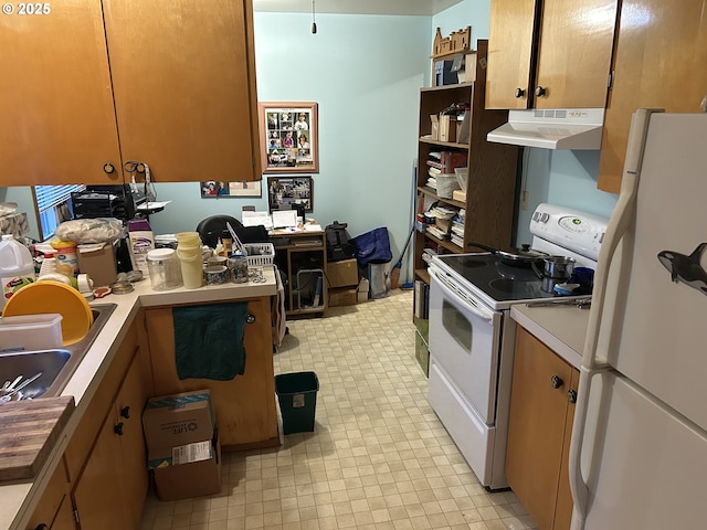 kitchen featuring sink and white appliances