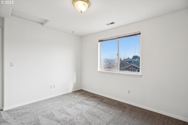 spare room featuring carpet flooring