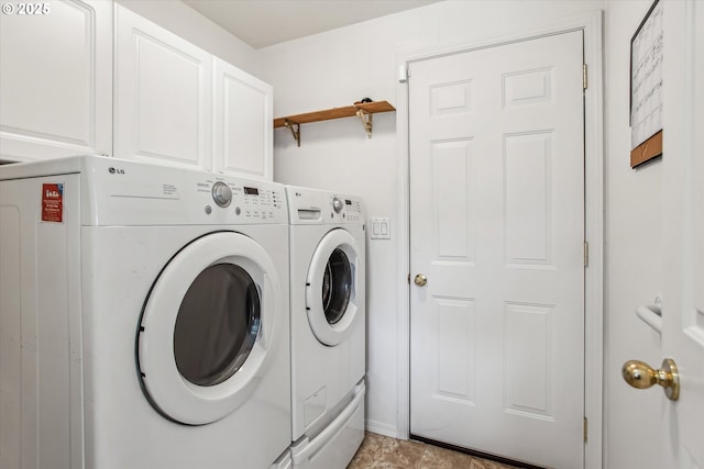 laundry room featuring cabinets and independent washer and dryer