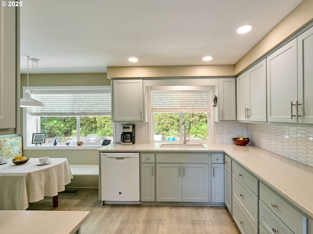 2235 Juntura Ct S, Salem, OR 97302 - kitchen with plenty of natural light, white dishwasher, a sink, and light countertops