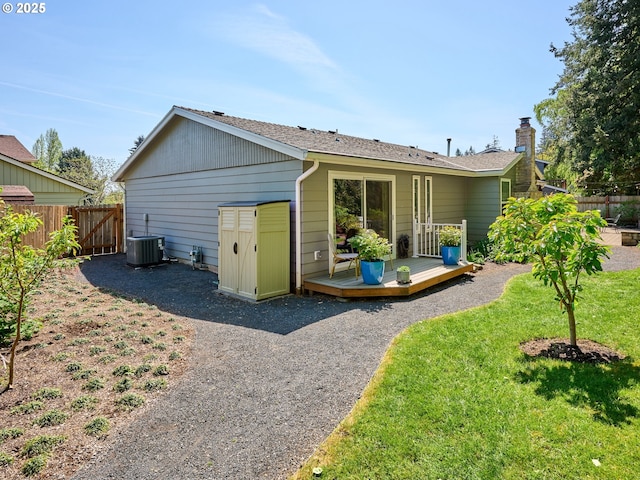 2235 Juntura Ct S, Salem, OR 97302 - rear view of property with a chimney, fence, a deck, and cooling unit