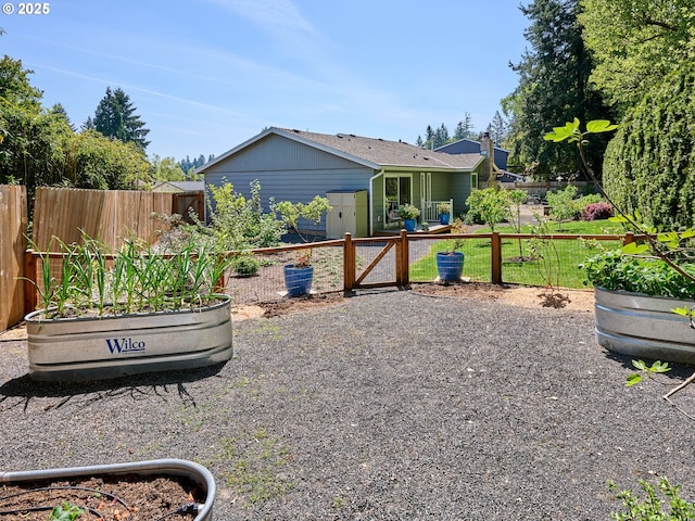 2235 Juntura Ct S, Salem, OR 97302 - view of yard featuring fence, a garden, and a gate
