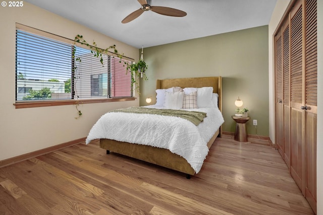 1040 NW Naito Pkwy Unit O-10, Portland, OR 97209 - bedroom featuring a closet, wood finished floors, and ceiling fan
