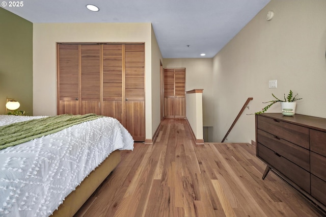 1040 NW Naito Pkwy Unit O-10, Portland, OR 97209 - bedroom with a closet, light wood-style floors, and recessed lighting