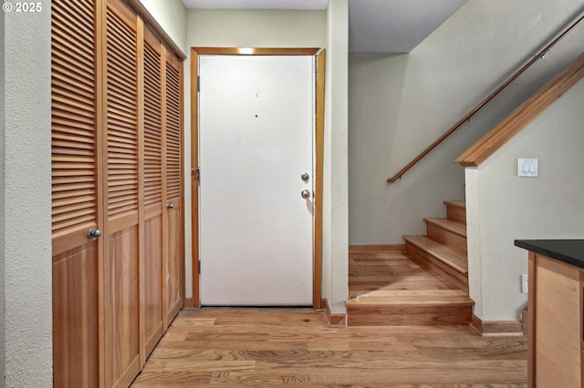 1040 NW Naito Pkwy Unit O-10, Portland, OR 97209 - entrance foyer featuring light wood finished floors and stairs