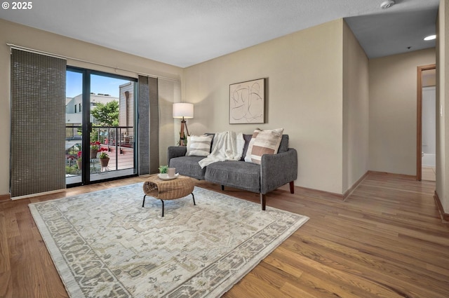 1040 NW Naito Pkwy Unit O-10, Portland, OR 97209 - living area with wood finished floors