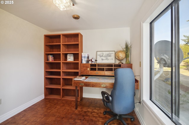 home office featuring dark parquet flooring