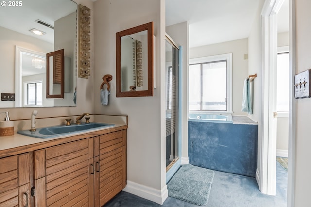 bathroom featuring plus walk in shower and vanity