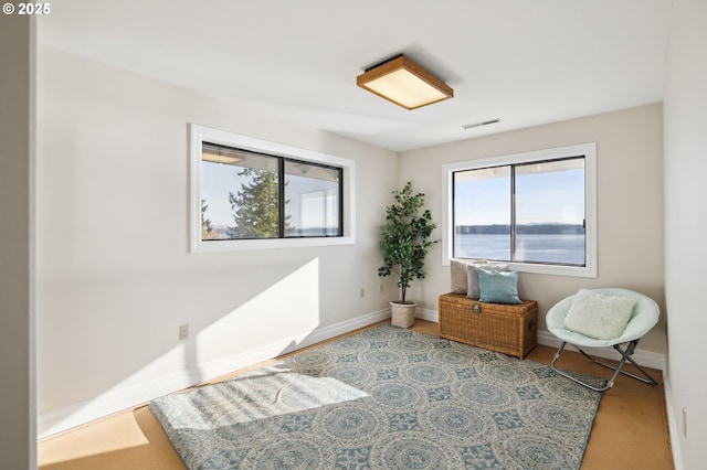 living area featuring a water view