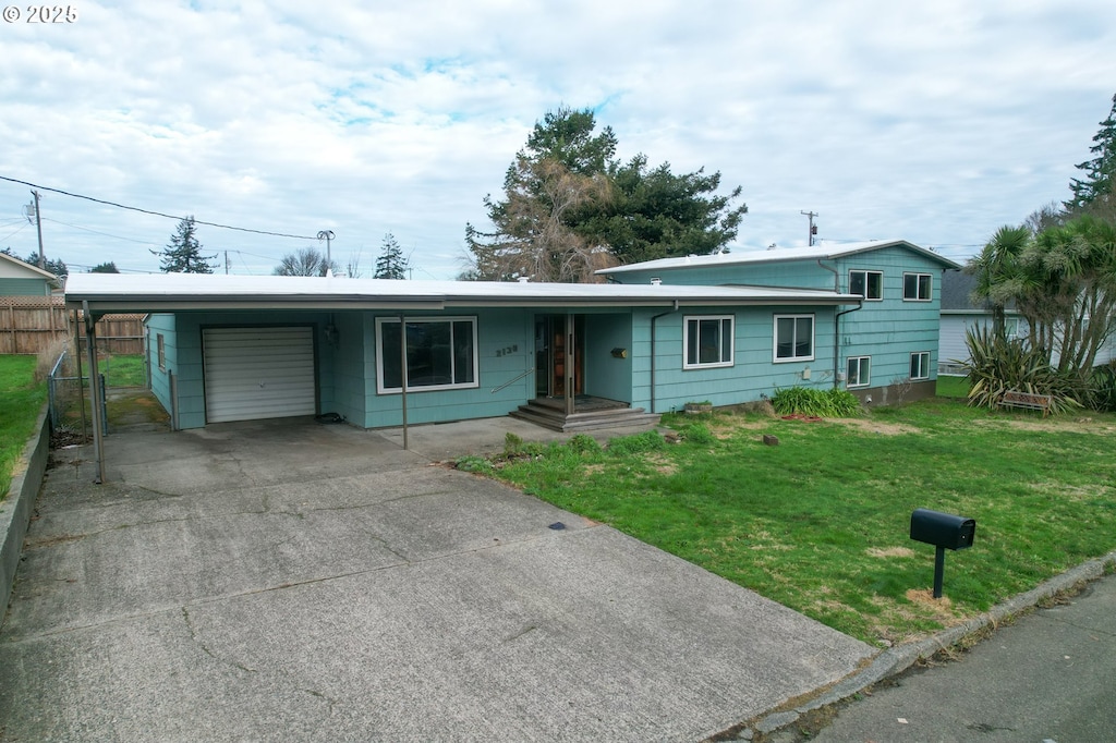 ranch-style house with a carport and a front yard