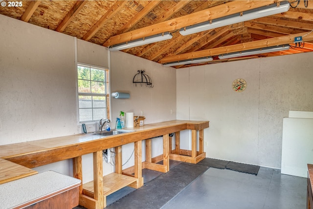 1545 E Fourth Ave, Sutherlin, OR 97479 - miscellaneous room with a sink, lofted ceiling, and concrete flooring