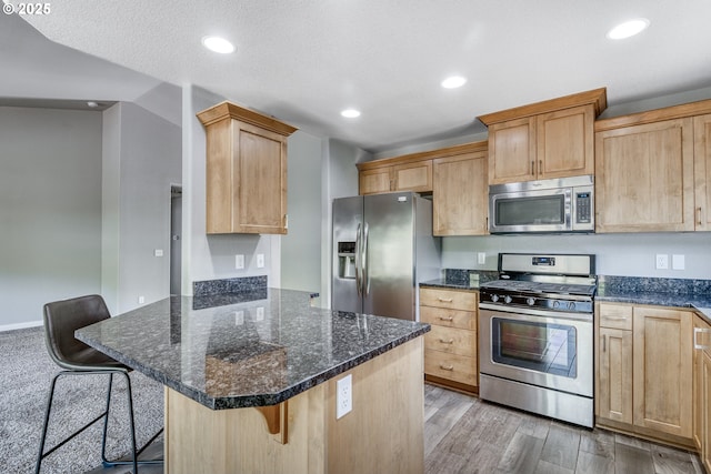 1545 E Fourth Ave, Sutherlin, OR 97479 - kitchen featuring stainless steel appliances, a kitchen breakfast bar, a peninsula, recessed lighting, and dark stone counters