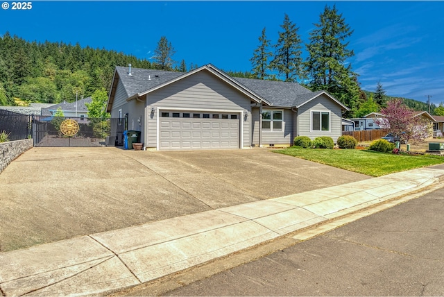1545 E Fourth Ave, Sutherlin, OR 97479 - single story home featuring a garage, concrete driveway, and a shingled roof