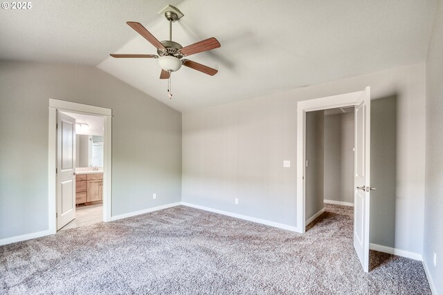 1545 E Fourth Ave, Sutherlin, OR 97479 - unfurnished bedroom with carpet floors, lofted ceiling, ceiling fan, and ensuite bathroom
