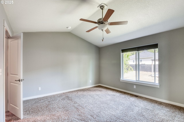 1545 E Fourth Ave, Sutherlin, OR 97479 - carpeted empty room featuring vaulted ceiling, a ceiling fan, and baseboards