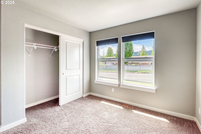 1545 E Fourth Ave, Sutherlin, OR 97479 - unfurnished bedroom with carpet flooring, a closet, and baseboards