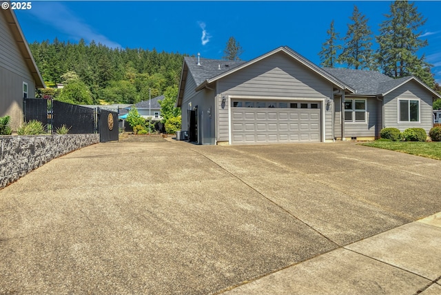 1545 E Fourth Ave, Sutherlin, OR 97479 - single story home with driveway, an attached garage, and roof with shingles