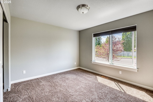 1545 E Fourth Ave, Sutherlin, OR 97479 - carpeted empty room featuring baseboards