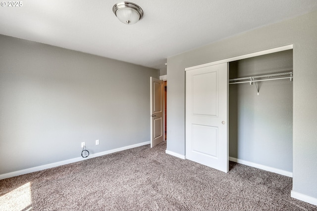 1545 E Fourth Ave, Sutherlin, OR 97479 - unfurnished bedroom featuring carpet floors, a closet, and baseboards