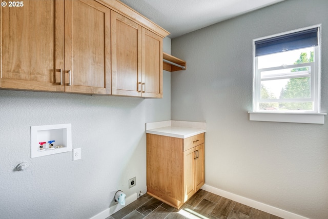 1545 E Fourth Ave, Sutherlin, OR 97479 - laundry room featuring hookup for a gas dryer, hookup for an electric dryer, hookup for a washing machine, cabinet space, and dark wood-type flooring