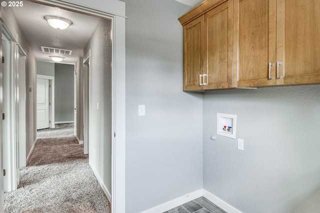 1545 E Fourth Ave, Sutherlin, OR 97479 - laundry area with hookup for a washing machine, cabinet space, baseboards, and carpet floors