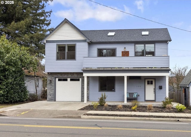 view of property featuring driveway, a garage, a porch, and roof with shingles