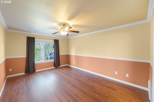 spare room with hardwood / wood-style flooring, ornamental molding, ceiling fan, and a textured ceiling