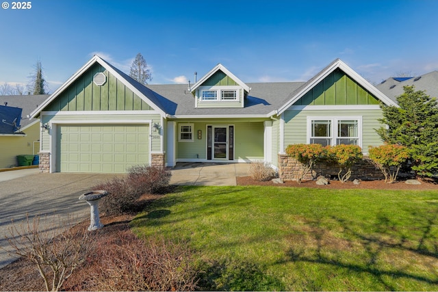 craftsman-style house with a garage and a front yard