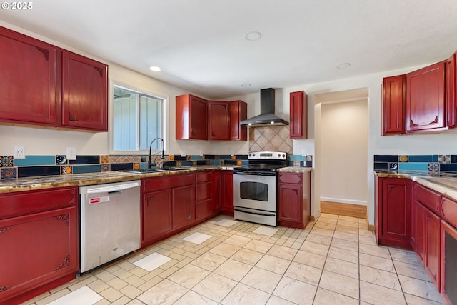 400 S 28th Ave, Cornelius, OR 97113 - kitchen featuring appliances with stainless steel finishes, wall chimney range hood, reddish brown cabinets, a sink, and recessed lighting